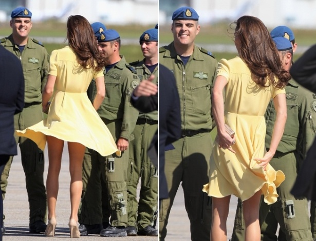 Duquesa Catherine segura vestido, que quase levanta com o vento, enquanto conversa com soldados no aeroporto de Calgary, Canadá (7/7/2011)